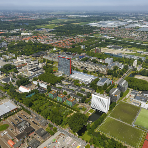 This slide displays TU Delft luchtfoto.